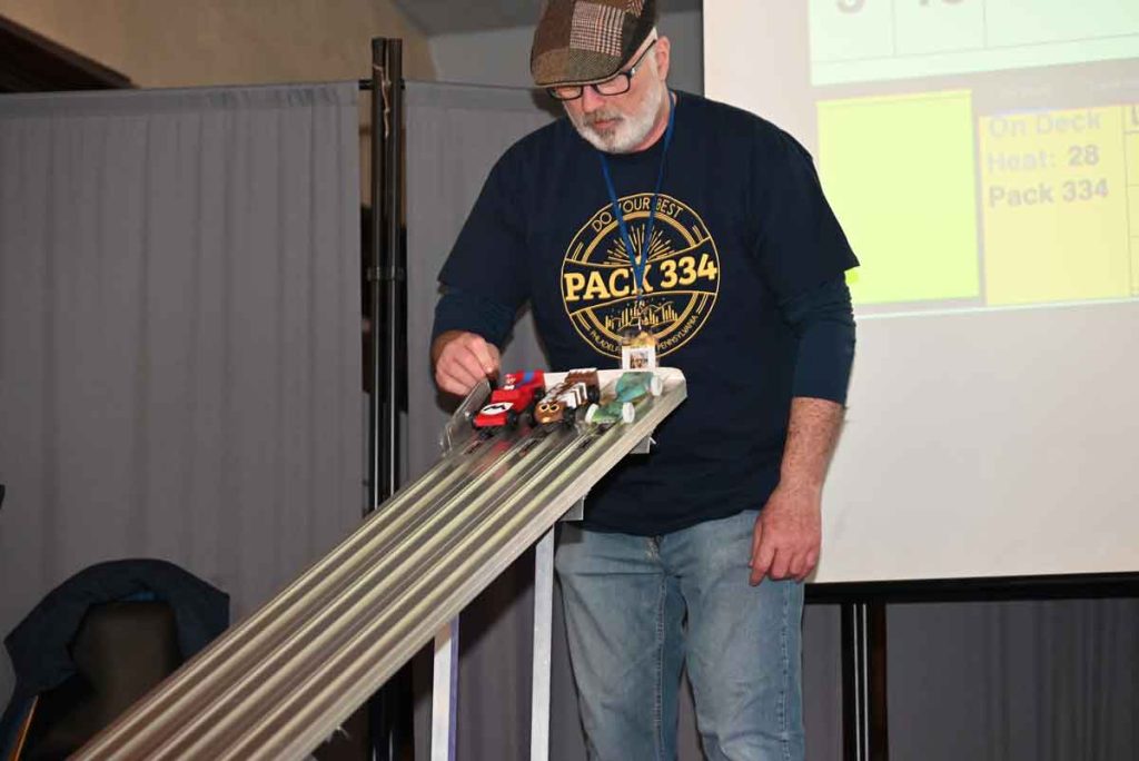 Cub Scout Pack 334 2024 Pinewood Derby volunteer Jim McHale serving as Race Start Boss